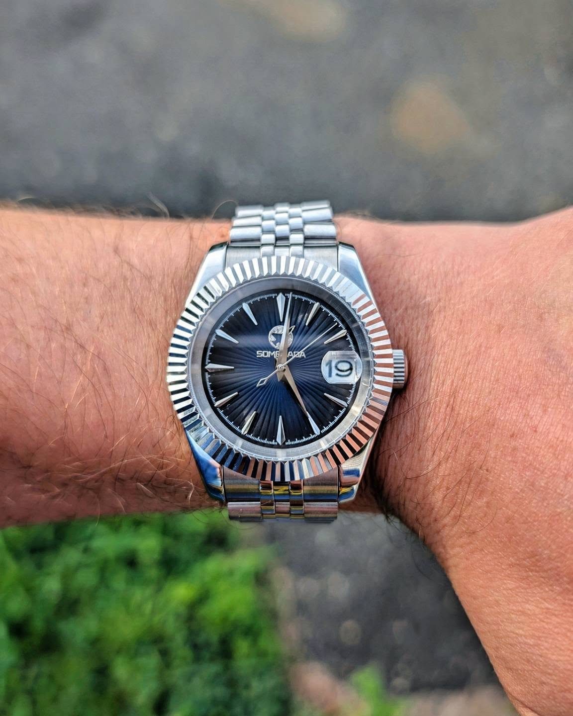 Blue sunray dial Somerada watch with fluted bezel on jubilee bracelet